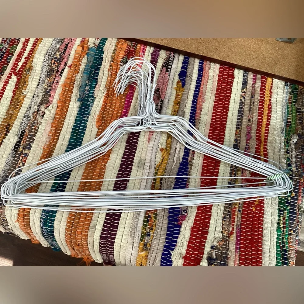 25 white wire hangers from dry cleaners